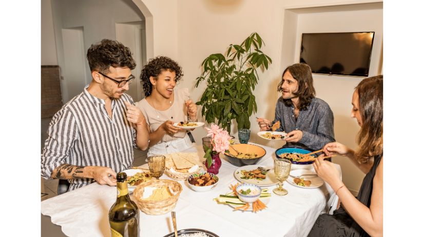 Group of people enjoying their time with each other while having dinner